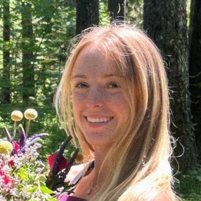 Madison Tilley smiling in the forest